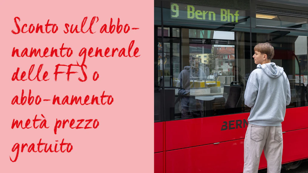Giovane con felpa grigia con cappuccio in piedi accanto a un tram rosso con indicazione '9 Bern Bhf'